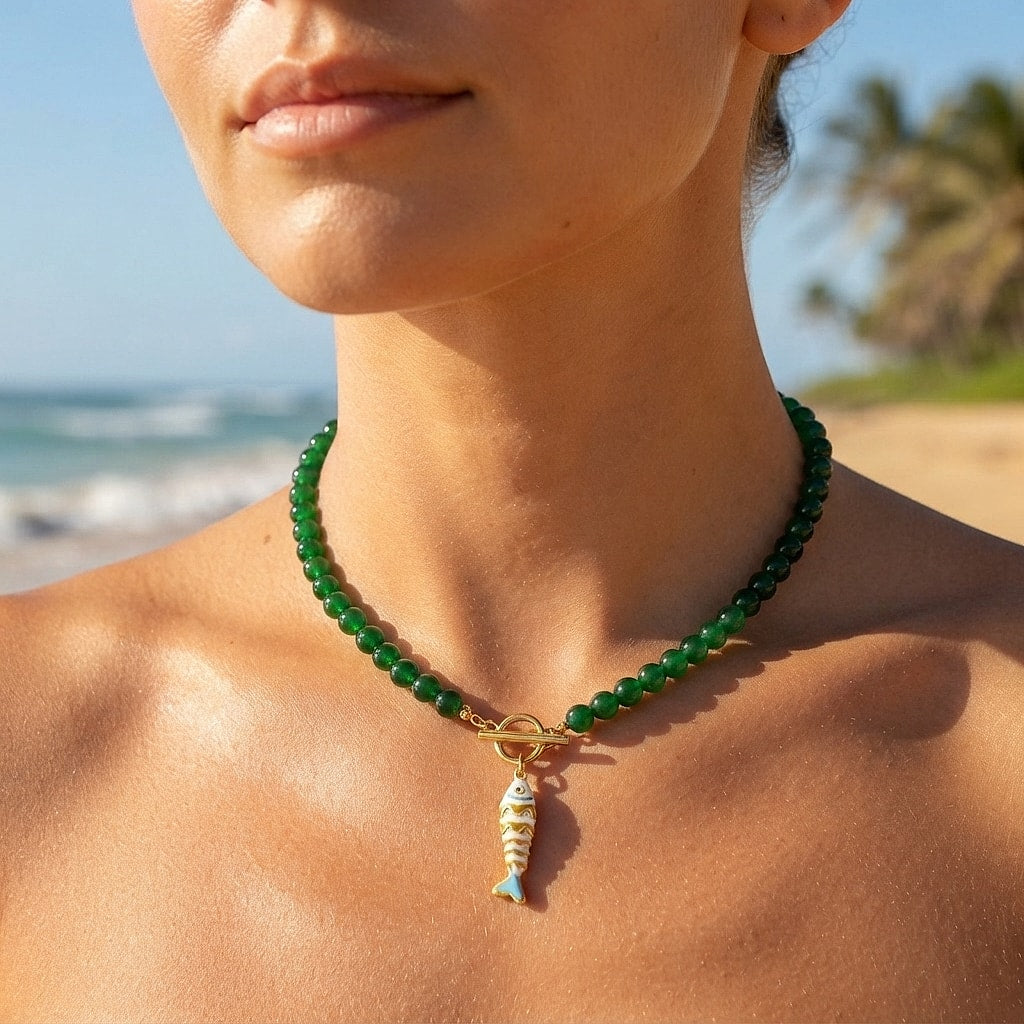 Light blue beaded koi fish necklace close-up at the collarbone