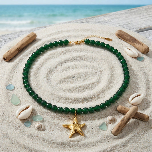 Dark green beaded necklace with a gold star charm