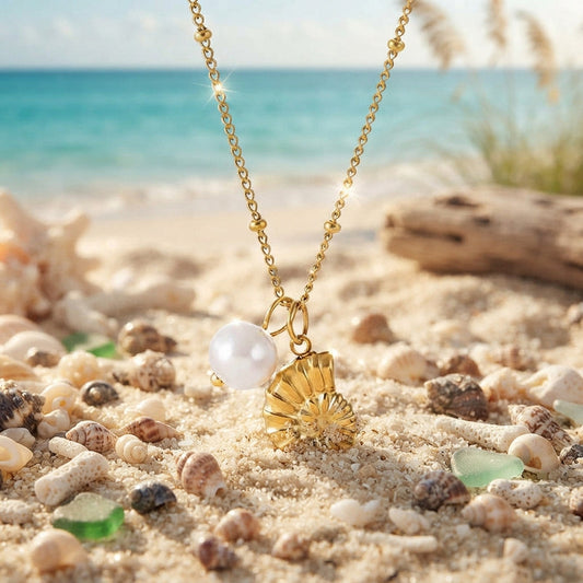Gold conch and faux pearl pendant necklace