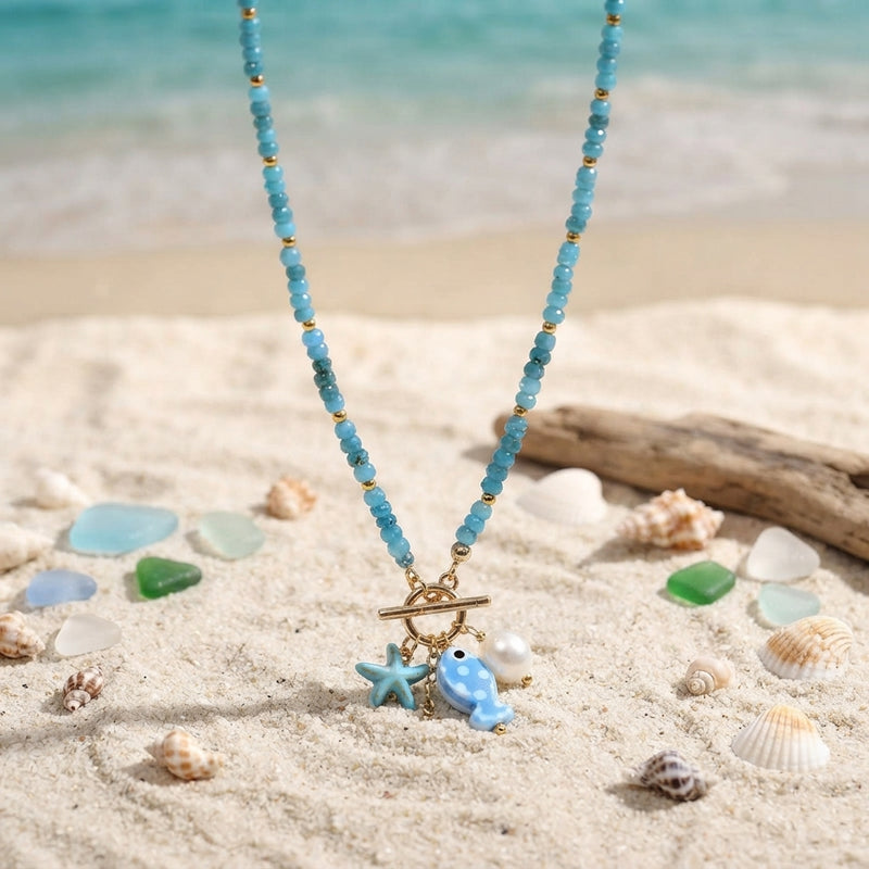 Blue and gold ceramic fish and pearl necklace