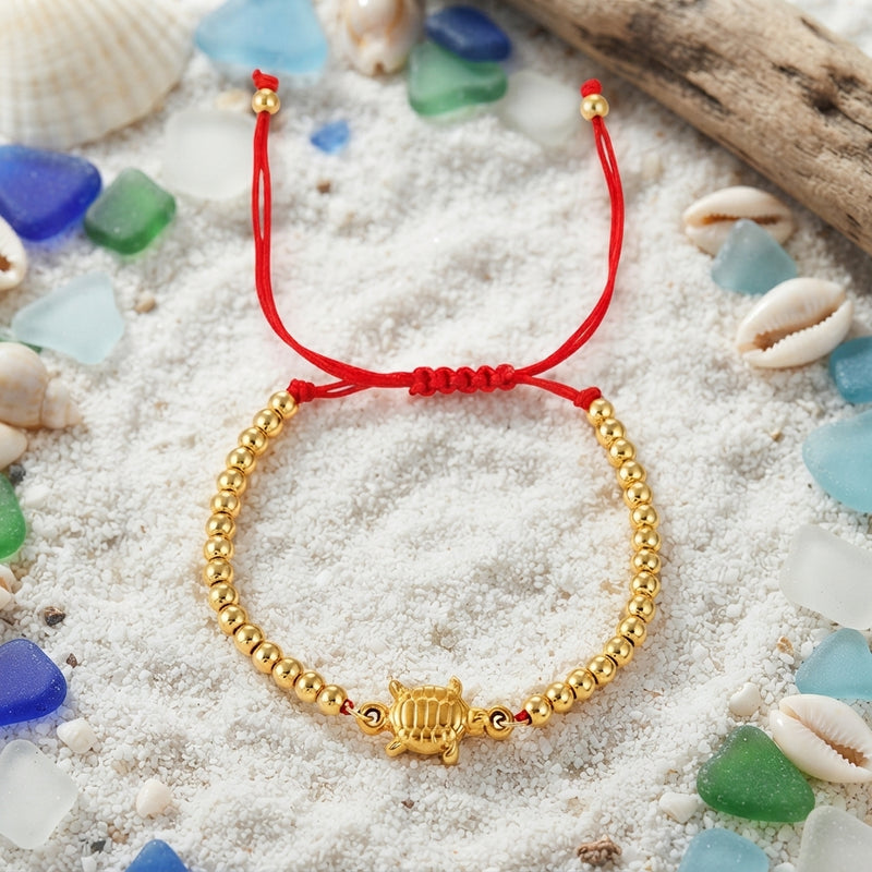 Red and gold turtle bead braided bracelet
